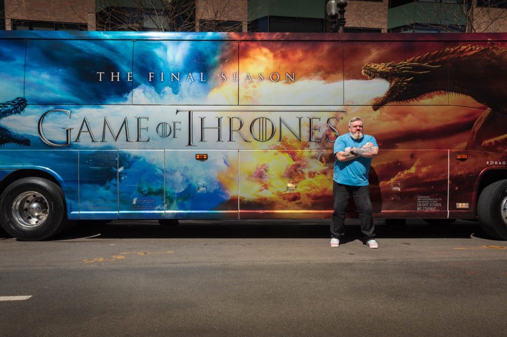Our beloved Hodor (Kristian Nairn) poses in front of the "Dragon Wagon" in Boston.